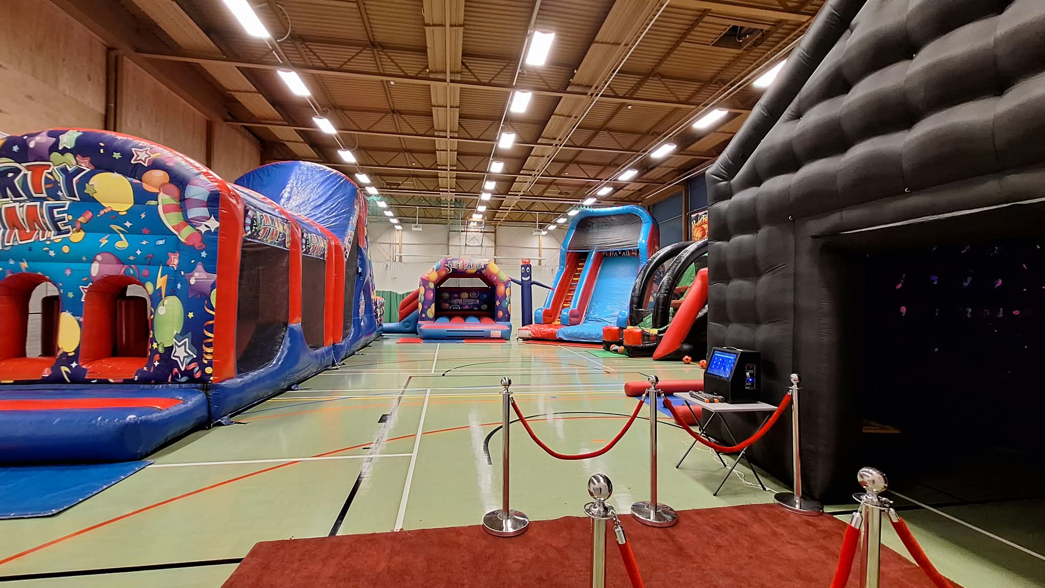 Large indoor inflatable entertainment setup available for corporate events in Southampton