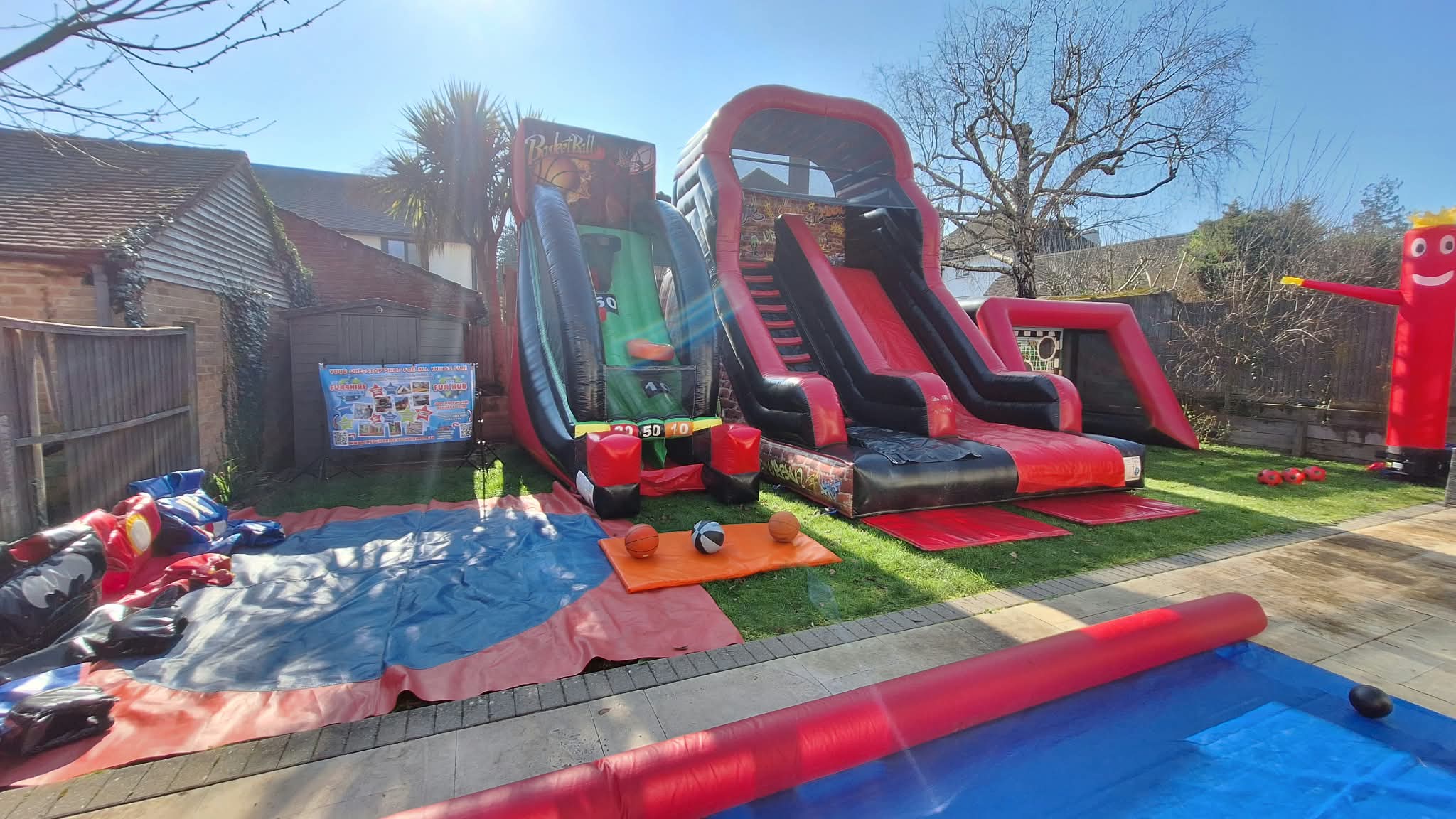 Inflatable slide and competitive games arranged for an outdoor event