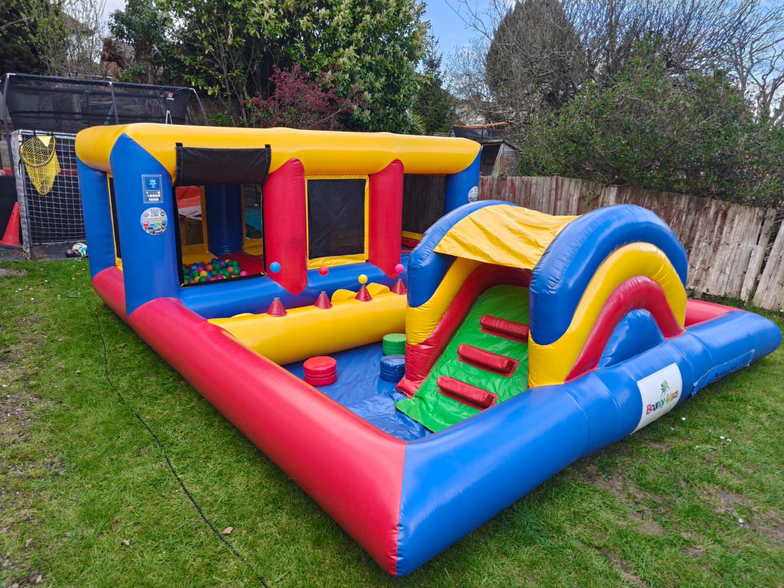 Children’s bouncy castle and inflatable slide setup available for parties in Southampton